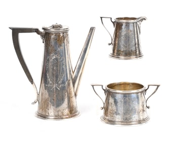 A Three Piece Sterling Silver Demitasse Set