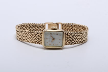 A Gold Ladies Watch by Tiffany & Co.