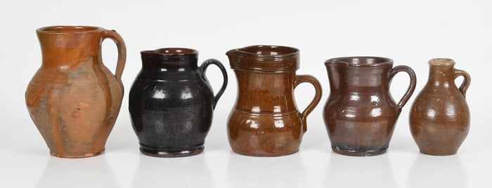 Five American Redware and Stoneware Jugs, 19th Century