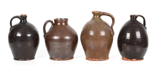 Four American Lead and Manganese Glazed Redware Ovoid Jugs, 19th Century