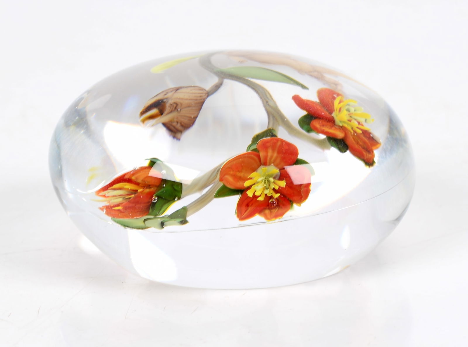 Paul Stankard (b. 1943) Paperweight, Botanical: A botanical paperweight by Paul Stankard, signed "Paul J. Stankard 1983" Dimensions: approximately H 1 5/8" x W 3" Provenance: From a local collection.