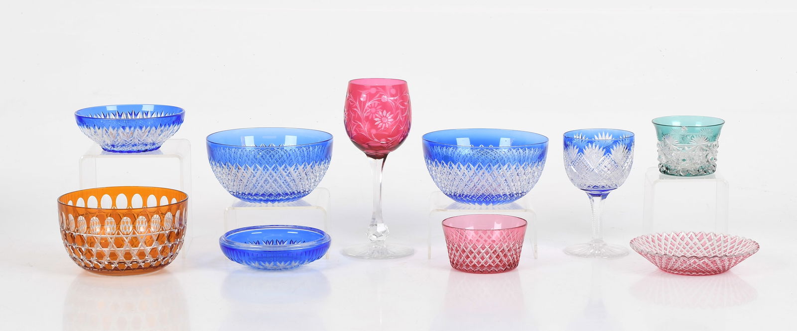 A Group of Colored Cut Glass Att. To Dorflinger: A Group of Colored Cut Glass Att. to Dorflinger All late 19th or early 20th century, comprising: A floral cut cranberry wine, a blue fan and diamond cut goblet, a small green vessel with fan and
