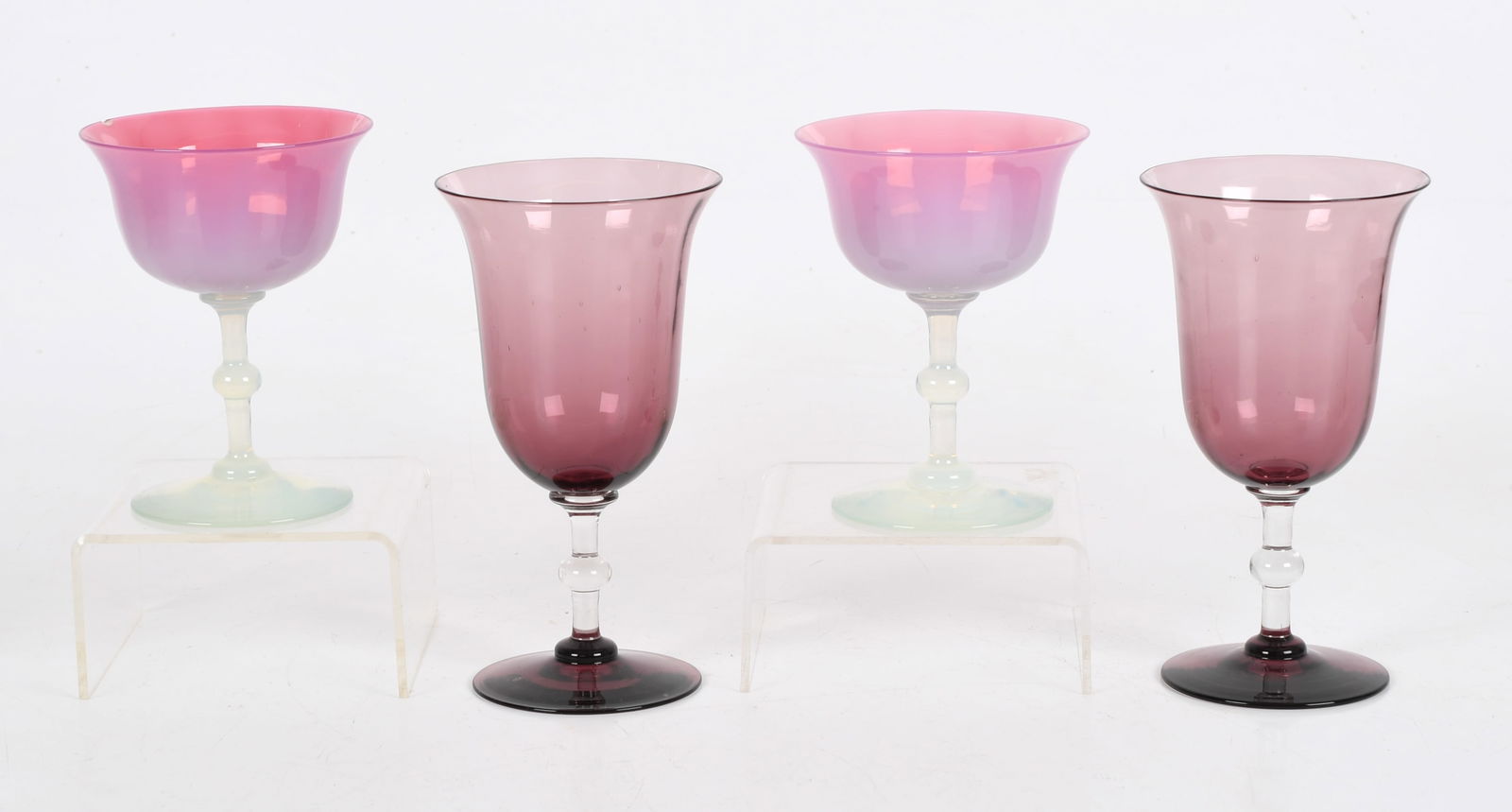 Four Dorflinger Glass Goblets: Four Dorflinger Glass Goblets A pair of amethyst and colorless examples and a pair of pink opalescent goblets, each with a knopped stem. Dimensions: 4 1/2in and 6 1/4in tall. &n