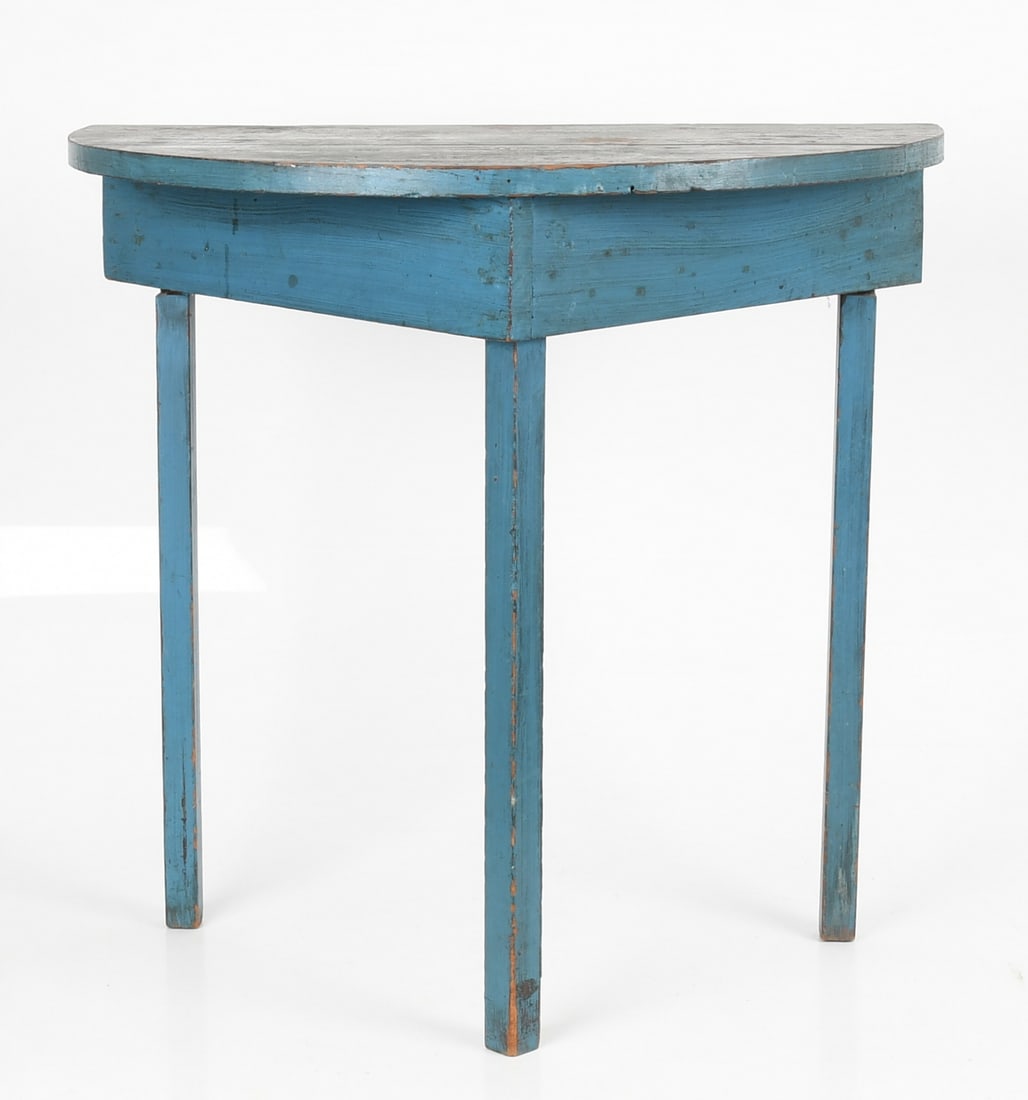 American Country Blue-Painted Demilune Console Table, Early 20th Century: An American Country Blue-Painted Demilune Console Table, Early 20th Century The demilune top over hanging a triangular frieze, raised on three square legs. Dimensions: Height 29 3/4in; width 31 1/2in;