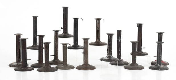 Seventeen Tinned Sheet Iron Hog Scraper Push-up Candlesticks, 19th Century