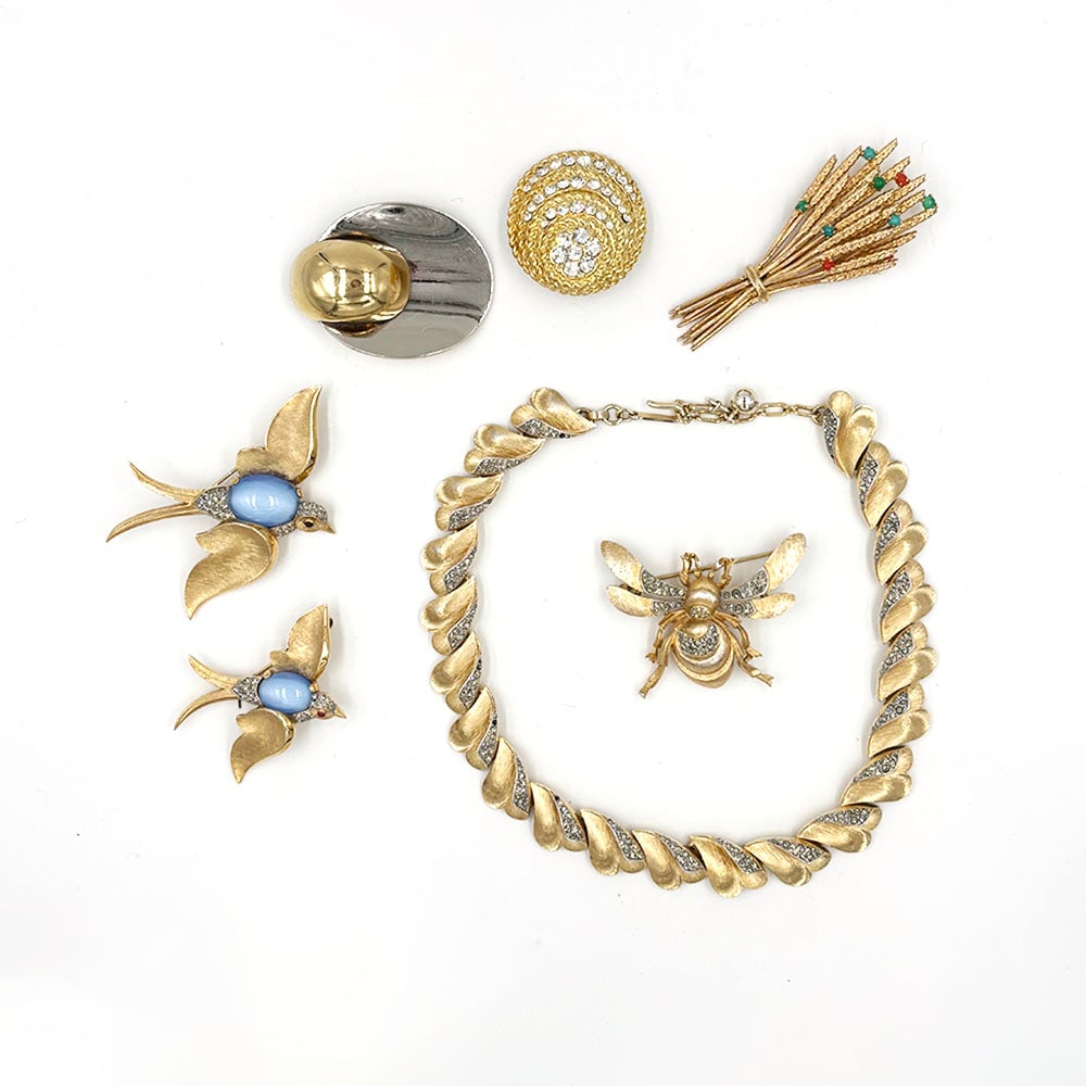 Seven piece Trifari Swallow Pins Grosse Pin: Seven piece lot includes a Trifari Necklace, two Trifari Swallow pins, measuring 2.75 inches and 2 inches. There is also a Trifari Bee pin measures 2inch. Also included are three signed Grosse Pins, d