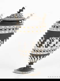 A Wedgwood Black Jasper Dip Covered Urn, Tricolor: A Wedgwood Black Jasper Dip Covered Urn, Tricolor Early 19th century, in black (dark grey), white, and yellow, the central figural scenes bordered with dice motif, arabesques, and other classica