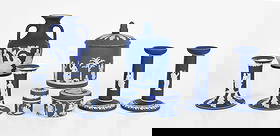 A Group of Wedgwood Royal Blue Jasper Dip: A Group of Wedgwood Blue Jasper Dip 19th and 20th centuries, comprising: a 6 1/2" tall covered jar with and acorn finial, a small 2 1/4" tall cylindrical box with central angel re