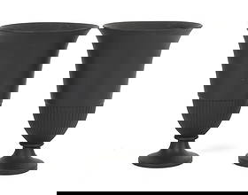 A Pair of Wedgwood Black Basalt Bough Pots: A Pair of Wedgwood Black Basalt Bough Pots A pair of urn form bough pots, each with a circular foot below a reeded and flared body, marked as pictured. Dimensions: each is 5 1/2in diameter