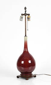 A Chinese Porcelain Flambe Glaze Vase/Lamp: A Chinese Porcelain Flambe Glaze Vase/Lamp A large bottle form Qing Dynasty example, later converted for use as a lamp. Dimensions: the vase is 17 1/2in tall and has a diameter of 8 1/2in,