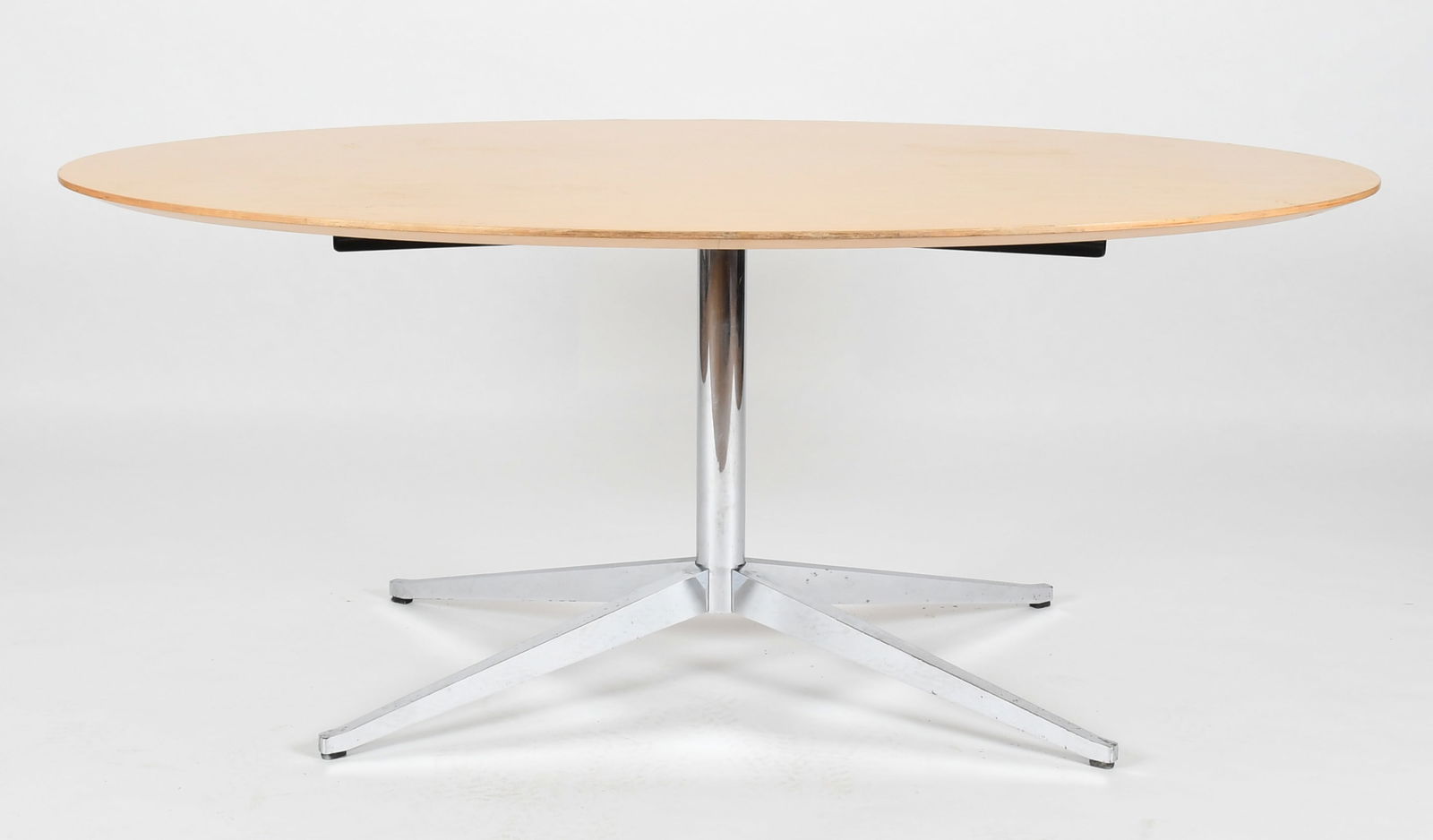 Florence Knoll Dining/Conference Table, 20th Century: A Florence Knoll Oval Dining / Conference Table, Second Half 20th Century The blonde wood veneered top raised on a chrome plated steel base with four tapered legs. With 'Knoll, Inc' label to u