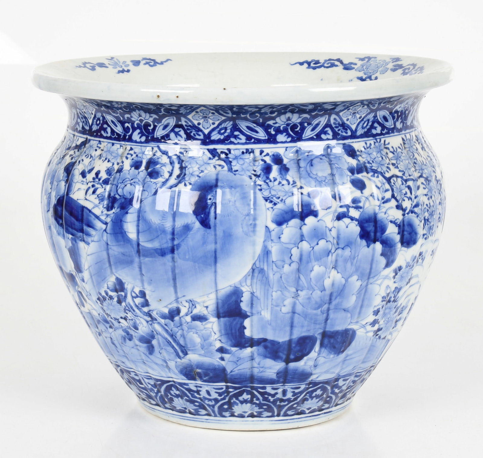 A Large Japanese Blue and White Porcelain Jardiniere: A Large Japanese Blue and White Porcelain Jardiniere A Meiji period example decorated with birds and flowers. Dimensions: 15in diameter and 12 1/2in tall. 