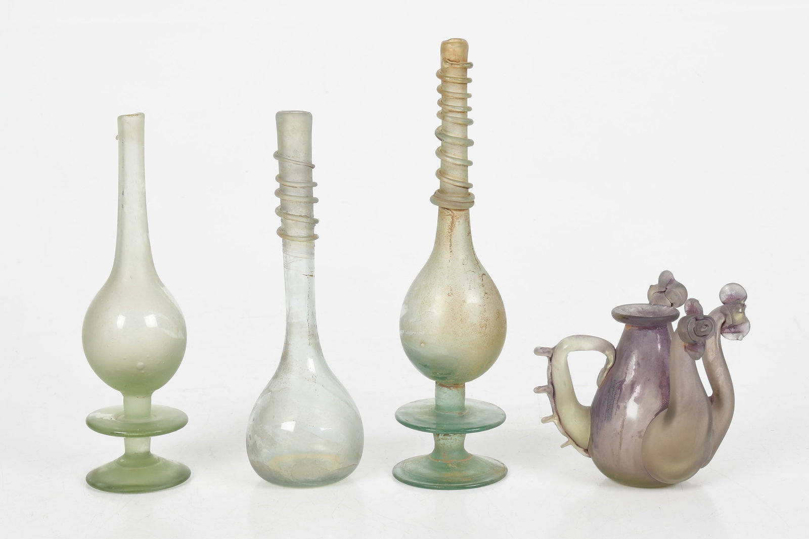 Four Pieces of Venetian Glass: Four Pieces of Venetian Glass Three slender vases with applied decoration and a purple glass vessel with three spouts and an open handle, all unmarked. Dimensions: from 2 1/4in to 4in diam