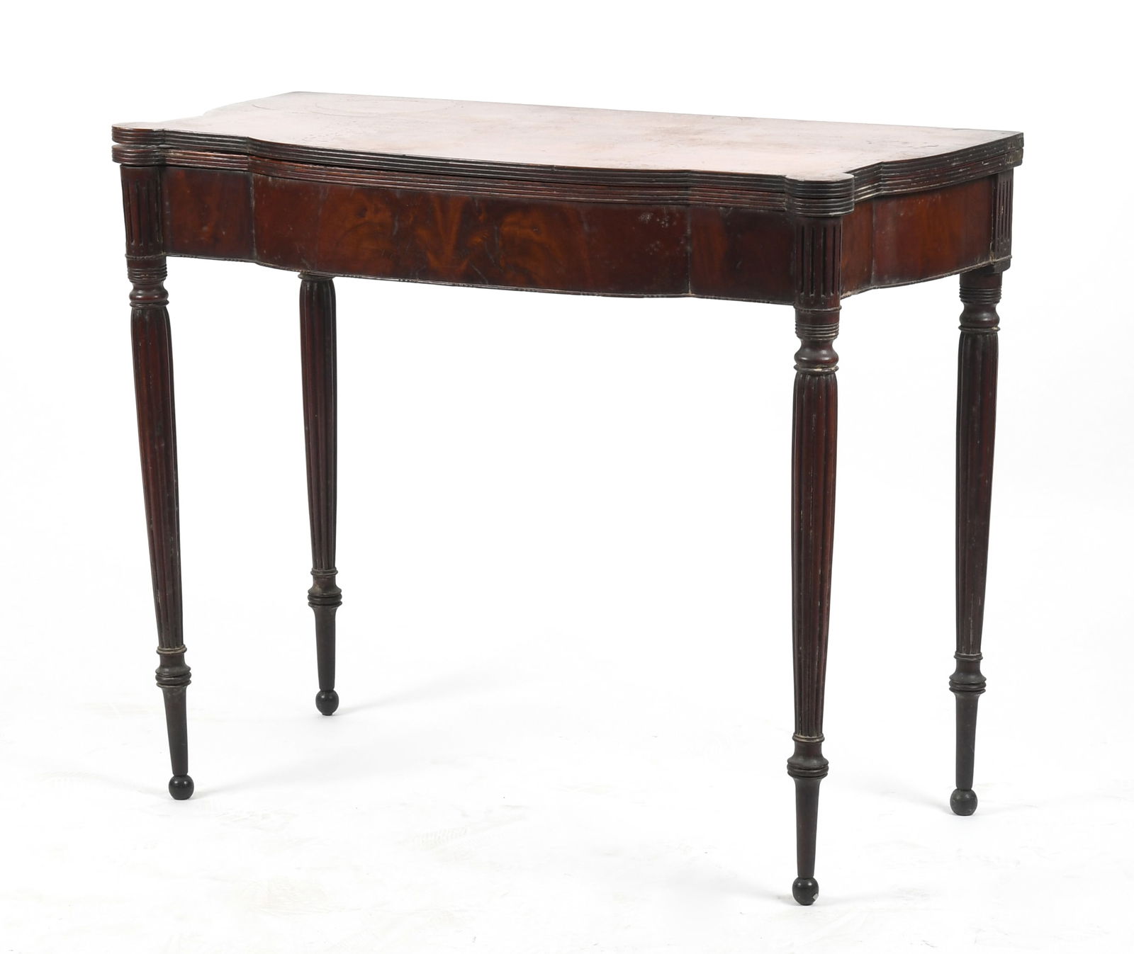 A Federal Carved Mahogany Card Table, Probably Massachusetts, Early 19th Century: A Federal Carved Mahogany Card Table, Probably Massachusetts, Early 19th Century The hinged shaped top above a book matched/veneer apron on carved fluted legs Dimensions