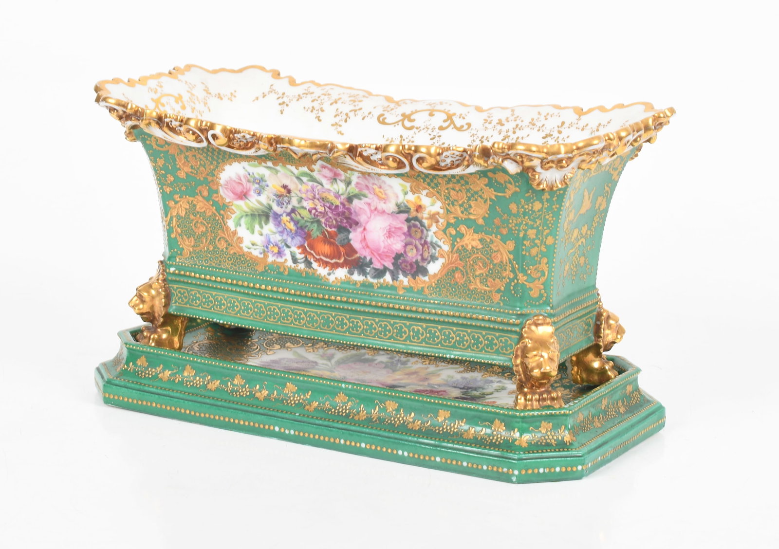 A Jacob Petit, Old Paris Jardiniere and Stand: A Jacob Petit, Old Paris Jardiniere and Stand First half of the 19th century, a porcelain jardiniere with paw feet below lion masks, the body with gilt decoration of foliation, birds