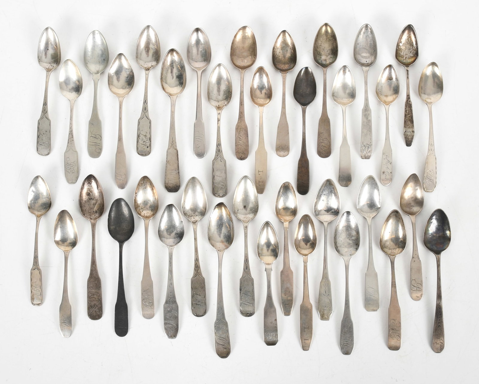 Thirty-Six American Coin Silver Teaspoons: Thirty-Six American Coin Silver Teaspoons Late 18th and early 19th centuries, comprising: a set of five 5 3/4in spoons by John Burt Lyng, NY, a set of three 5 1/2in coffin end spoons by Sa