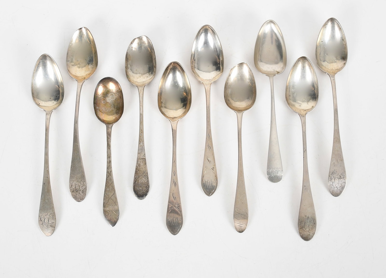 Ten Coin Silver Tablespoons, Mostly New England Makers: Ten Coin Silver Tablespoons, Mostly New England Makers Circa late 18th century, comprising: a pair of 9in bright-cut spoons possibly by William Holmes Jr., Boston, a set of four 