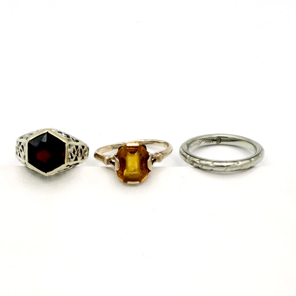 Vintage Filigree 10K, 14K, 18K Gold Gemstone Rings: Vintage Filigree 10K, 14K, 18K Gold Gemstone Rings 10K gold ring with yellow glass stone, a 14Km white gold filigree ring with garnet and an 18K white gold wedding