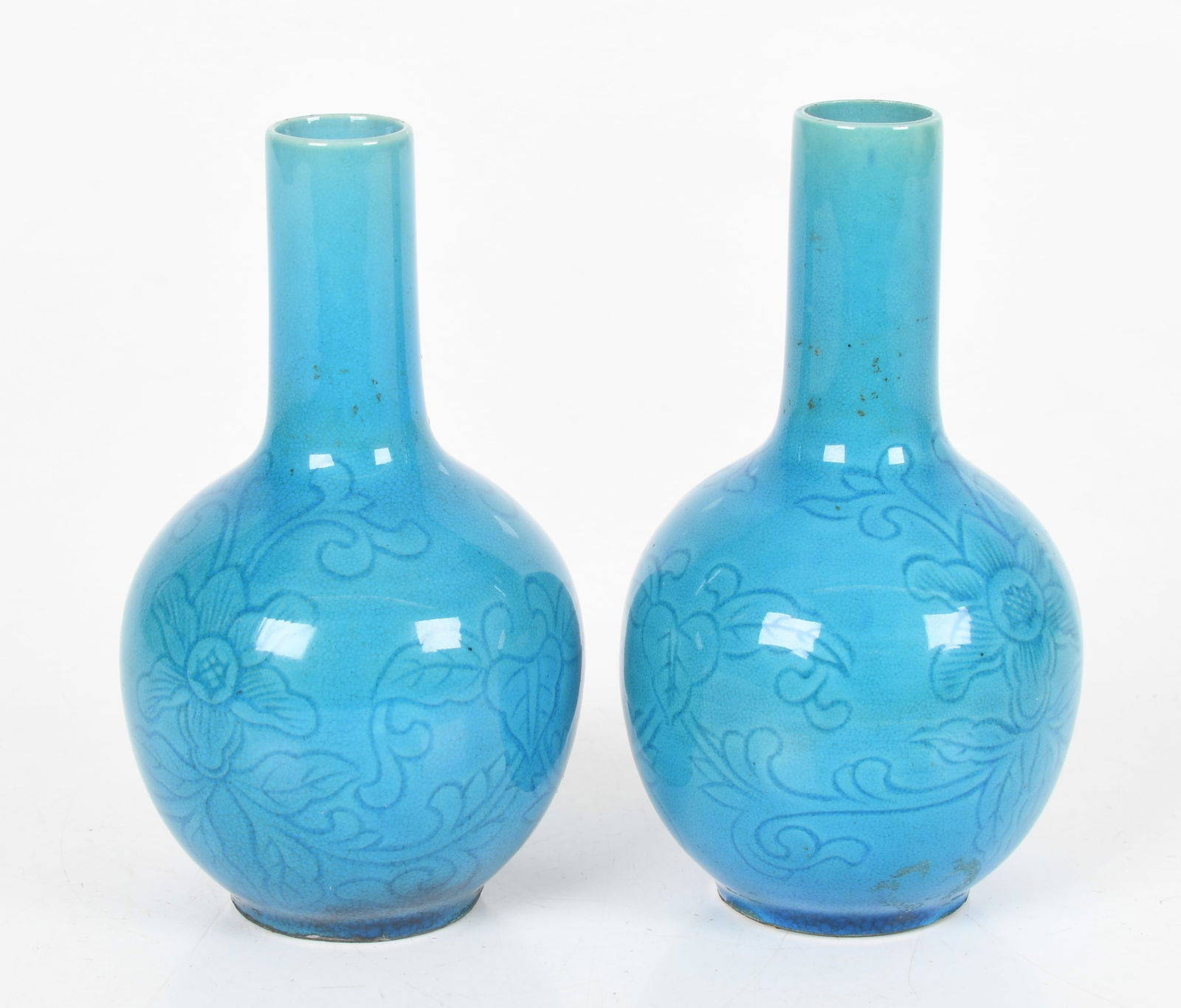 A Pair of Chinese Turquoise-Glazed Vases, 19th Century: A Pair of Chinese Turquoise-Glazed Vases, 19th Century In the Kangxi style with incised floral and foliate decoration. Dimensions: 3 in. x 3 in., 5 in. high 