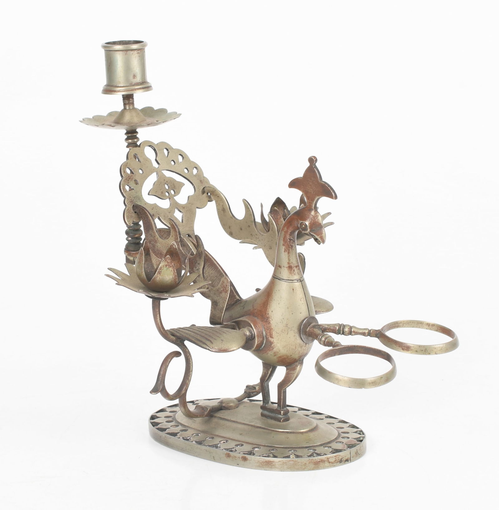An Indo-Persian Figural Metal Inkstand: An Indo-Persian Figural Metal Inkstand A peacock form example in a white metal alloy with pen rest, candleholder and two circular elements meant to receive inkwells. Dimensions: 7
