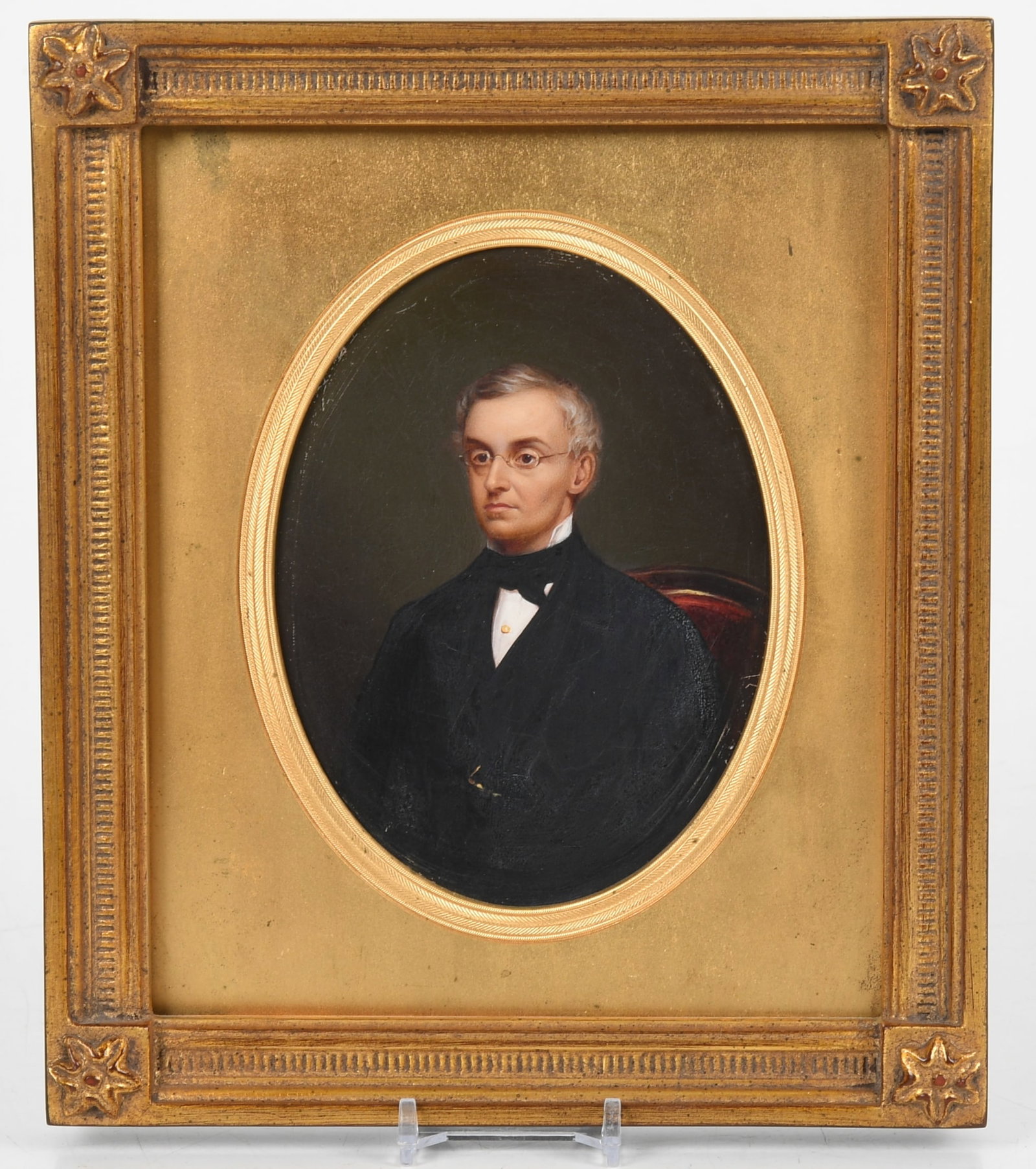 Continental School, c. 1830-1850, Portrait of a Gentleman with Glasses: Continental School, c. 1830-1850, Portrait of a Gentleman with Glasses oil on board; painted in an oval depicting a seated gentleman half-length with silver hair and glasses and in black dress