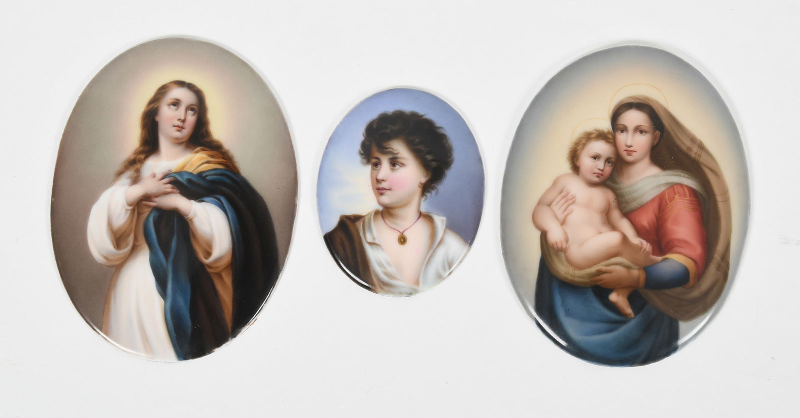 Three Continental Painted Porcelain Oval Plaques, Late 19th/ Early 20th Century: Three Continental Painted Porcelain Oval Plaques, Late 19th/ Early 20th Century Comprising: a depiction of the Sistine Madonna after Raphael (1483-1520), impressed on the reverse "S"