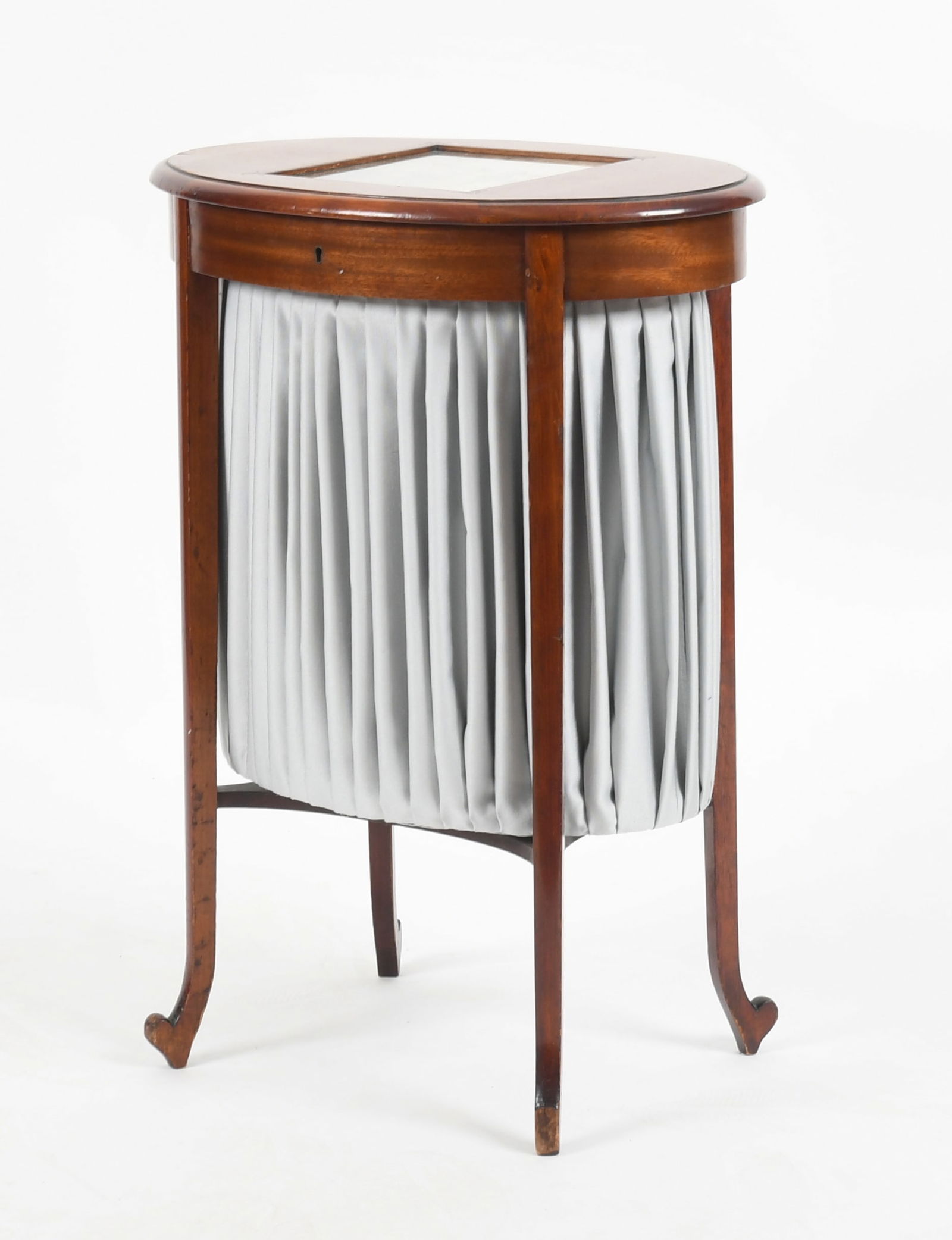 A Mahogany Sewing Table c. 1900: A Mahogany Sewing Table c. 1900 The oval hinged top with inset antique hand tinted engraving that opens to reveal an interior with central bag and several compartments. Dimensions: 20 1/2in