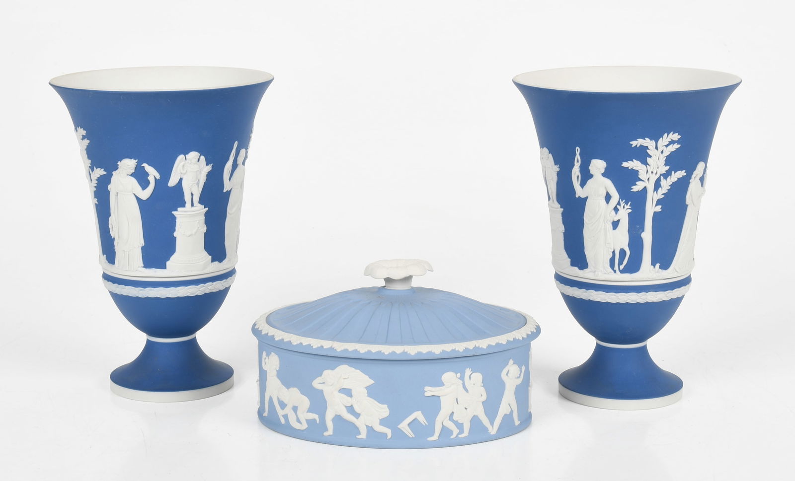 A Pair of Wedgwood Jasper Dip Vases and a Box: A Pair of Wedgwood Jasper Dip Vases and Box Contemporary, in Royal Blue with typical low-relief neo-classical decoration, and a covered box in pale blue and decorated with a continuous scene