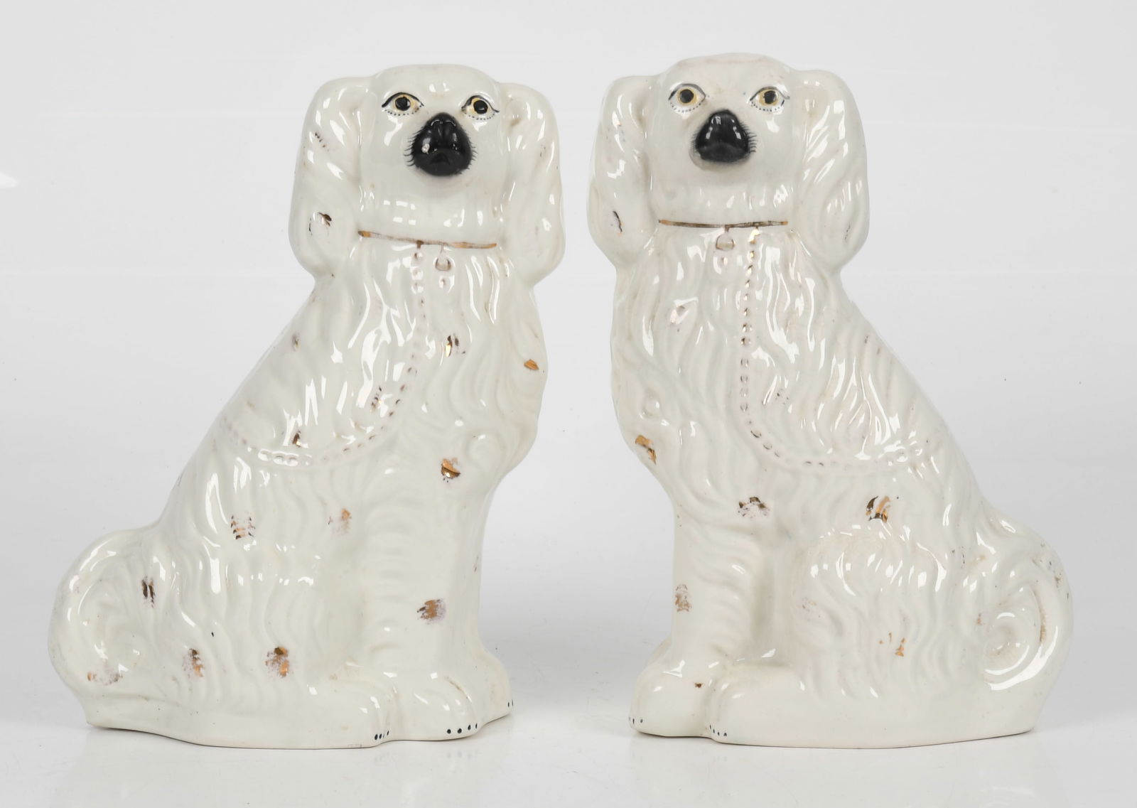 A Pair of English Staffordshire Spaniels, Mid 19th Century: A Pair of English Staffordshire Spaniels, Mid 19th Century With parcel-gilt decoration. Dimensions: 8 1/2 in. x 4 3/4 in., 14 1/2 in. high