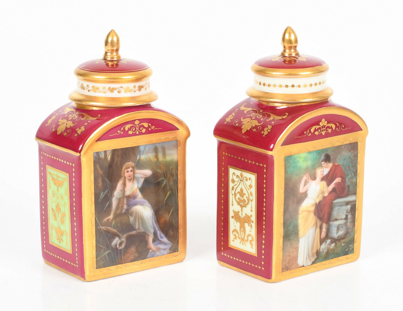 A Near Pair of Royal Vienna Hand-Painted Porcelain Lidded Tea Caddies, Late 19th Century: A Near Pair of Royal Vienna Hand-Painted Porcelain Tea Lidded Caddies, Late 19th Century One with gilt foliate decoration on a magenta ground, the front with hand-painted scene depicting two