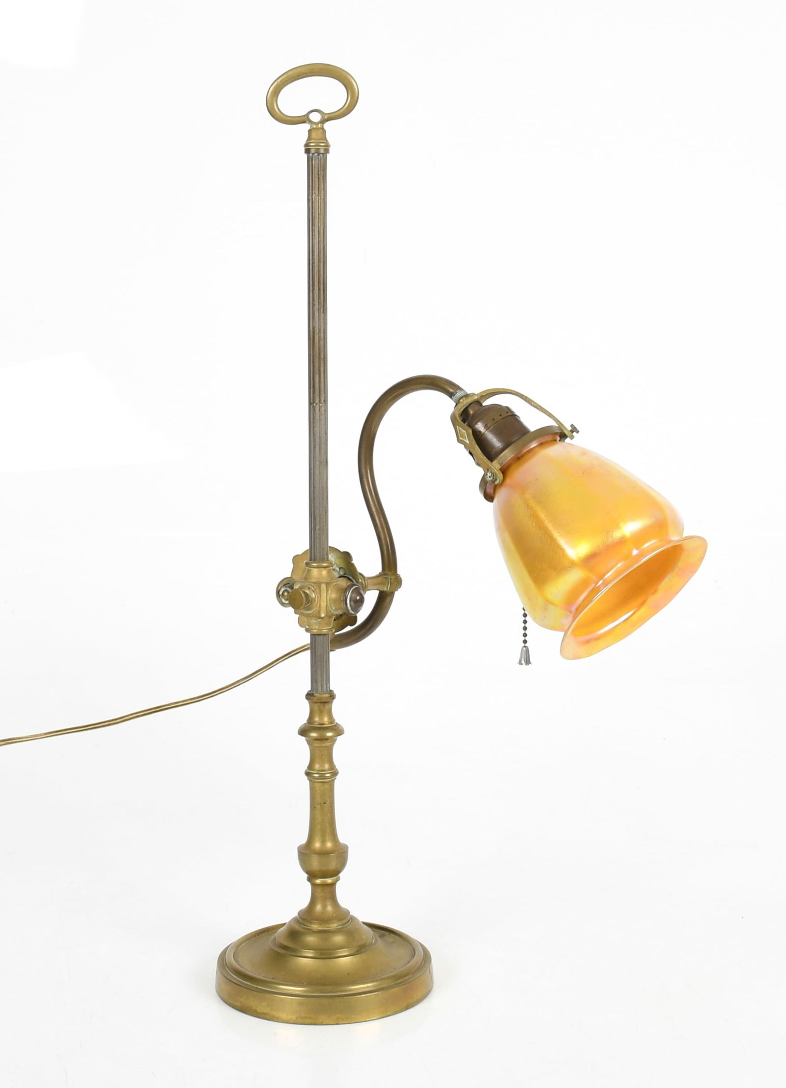 An French Brass and Opalescent Glass Desk Lamp: An French Brass and Opalescent Glass Desk Lamp Early 20th century, marked for "L'Universel / E.D Paris", having an adjustable height and nine-position articulating