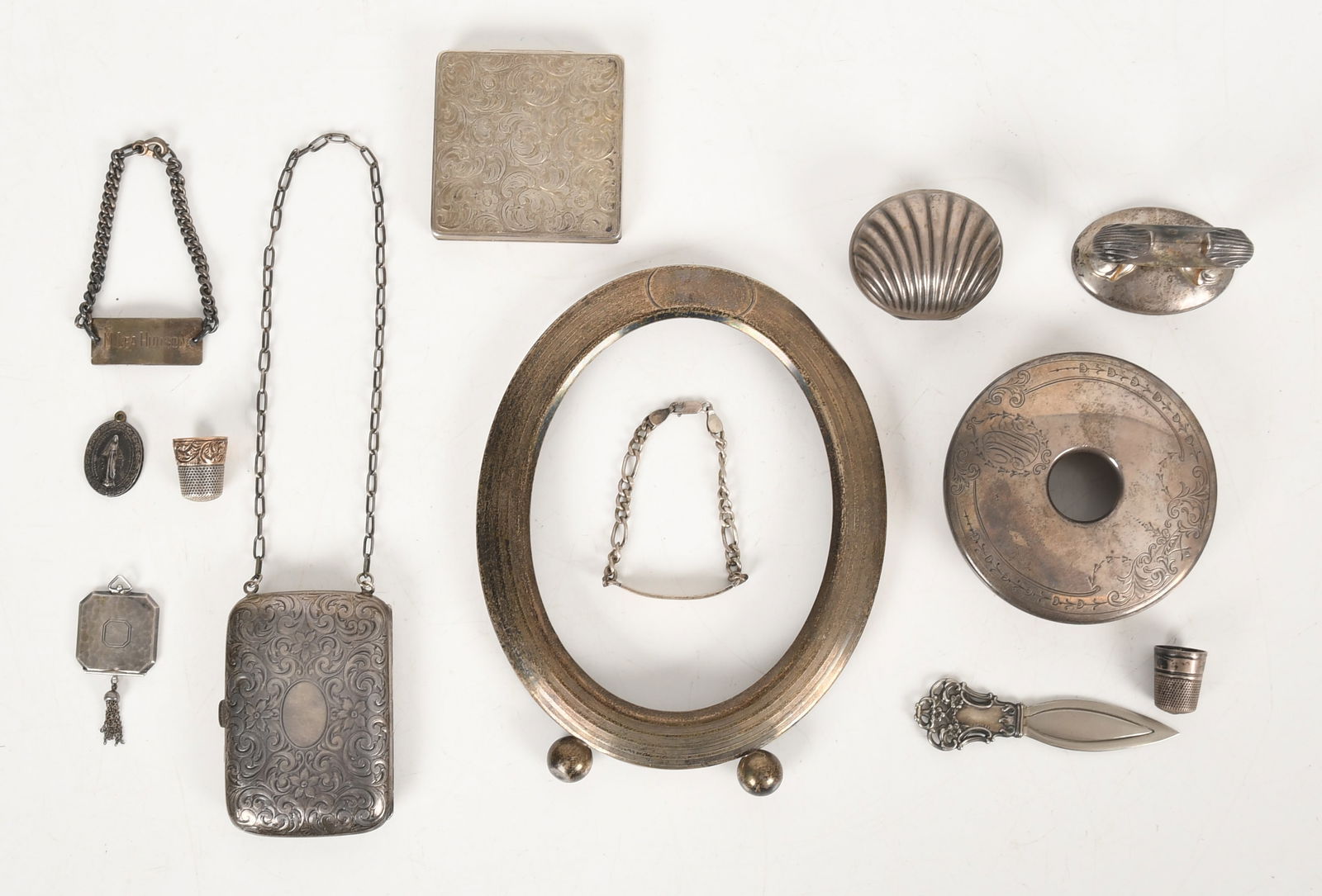 A Group of Sterling Everyday Items: A Group of Sterling Everyday Items Late 19th to the first half of the 20th century, comprising: a sterling silver picture frame (incomplete, just the silver frame) by Alvin, an exten