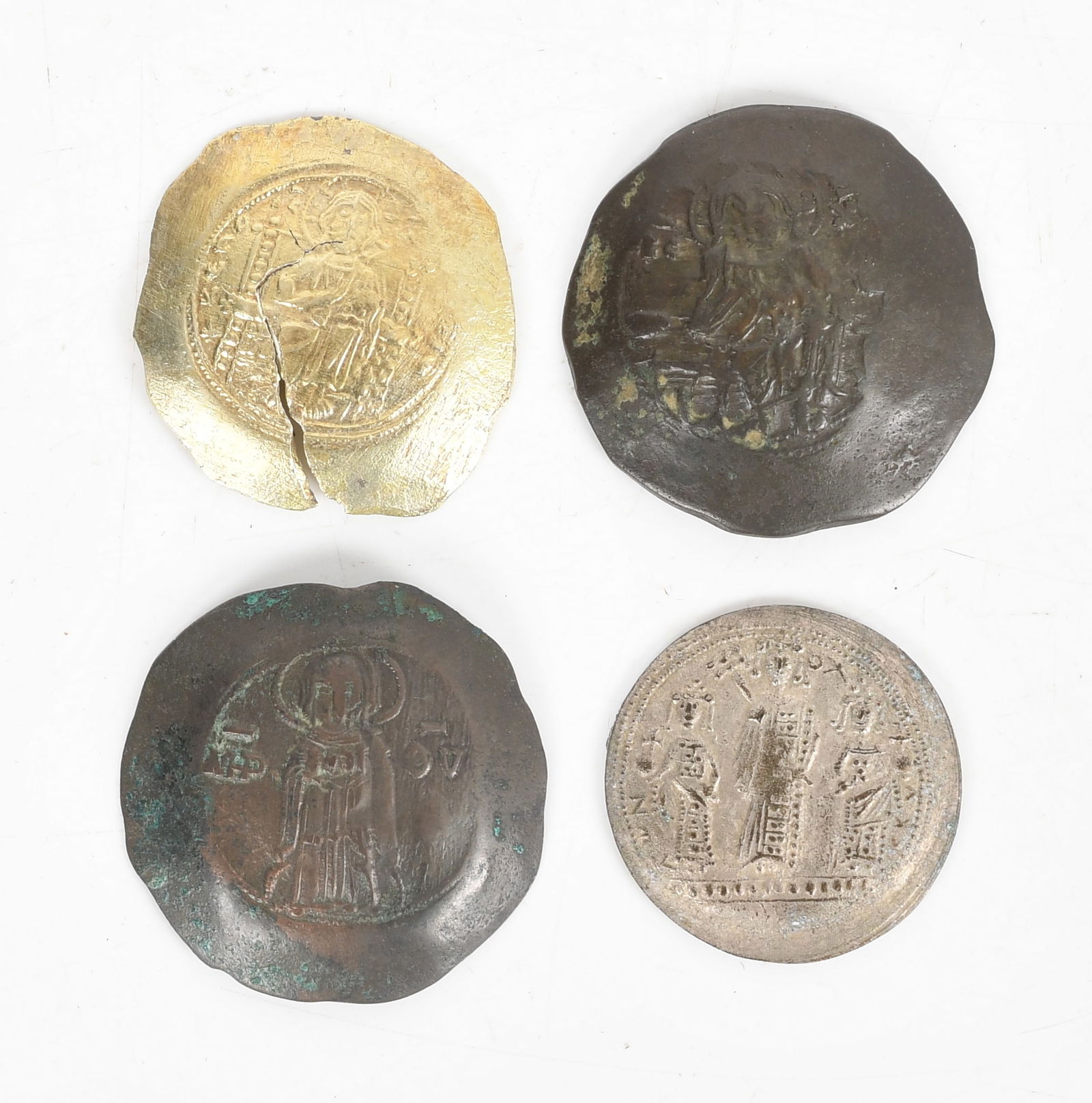 Four Byzantine Coins: Four Byzantine Coins First quarter of the 10th-millennia AD, two in bronze, one in silver and one in gold/electrum. Dimensions: diameters from 24 to 28.5mm 