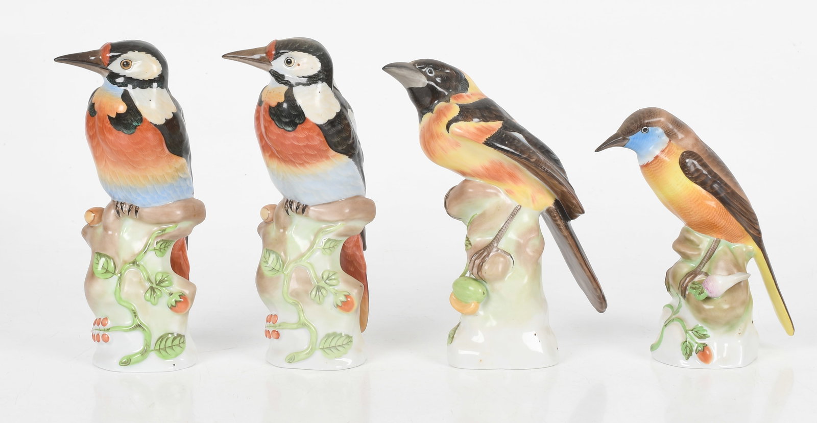 Four Herend Porcelain Large Birds, Late 20th Century: Four Herend Porcelain Large Birds, Late 20th Century Comprising: a pair of woodpeckers, a natural blackbird, and a nightingale; all hand-painted and marked on the undersides. Dimension