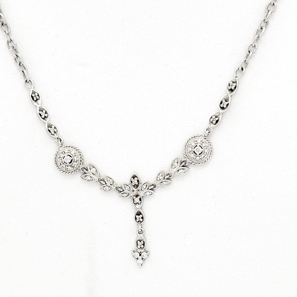 14K White Gold Diamond Necklace: 14K White Gold Diamond Necklace 14K white gold necklace set with forty-three small diamonds. Dimensions: Total weight .50ct. The necklace measures 17"L. The necklace weighs