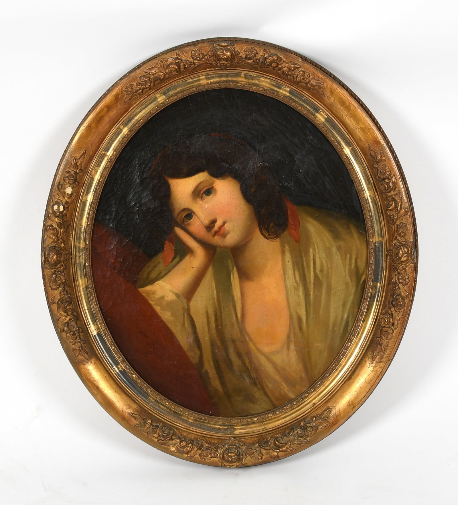 A Genre Portrait of a Young Girl: A Genre Portrait of a Young Girl Late 19th or early 20th century, oil on canvas, in a oval form depicting a girl in red and white drapery, unsigned. Dimensions: 22