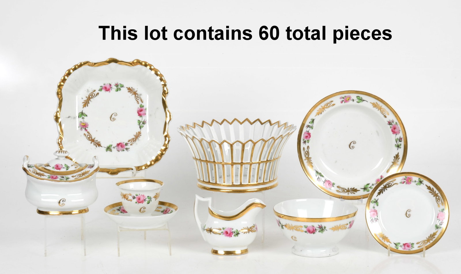 A Paris Porcelain Part Dessert Service, Late 19th Century: A Paris Porcelain Part Dessert Service, Late 19th Century Parcel-gilt with hand-painted pink roses and gilt "C"; unmarked. Comprising: a pierced centerpiece basket, a berry