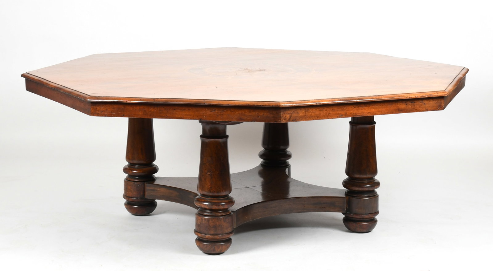 An English Inlaid Walnut Octagonal Dining Table, 19th Century: An English Inlaid Walnut Octagonal Dining Table, 19th Century The top inlaid with the Latin phrase "Nunc Est Bibendum", (Now is the time to drink.) Dimensions: 75 1/2