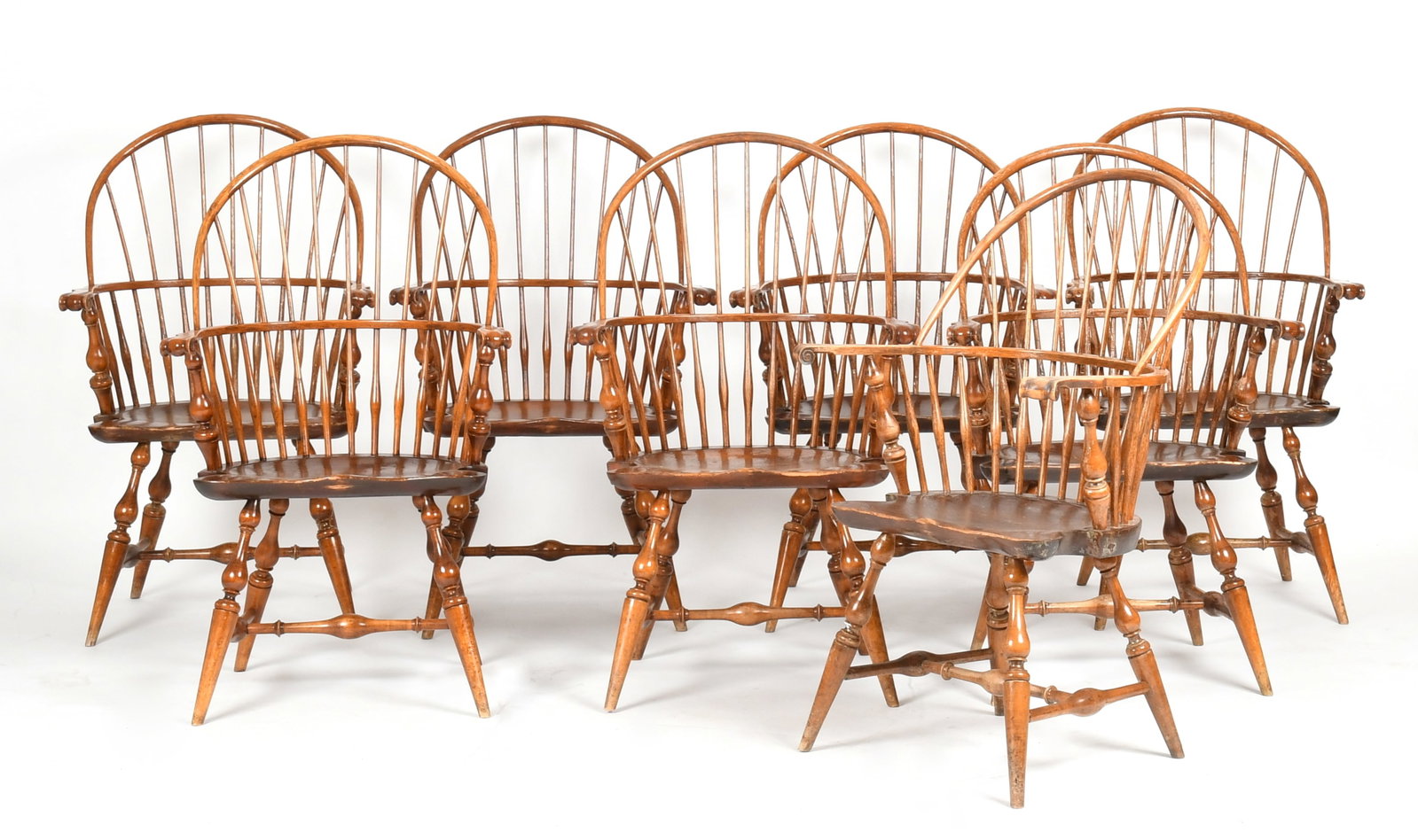 A Set of Eight Reproduction Bentwood Windsor Armchairs, Wallace Nutting, Early 20th Century: A Set of Eight Reproduction Bentwood Windsor Armchairs, Wallace Nutting, Early 20th Century With scroll knuckles, shaped saddle seats, turned legs and stretchers; each stamped "Wallace Nut