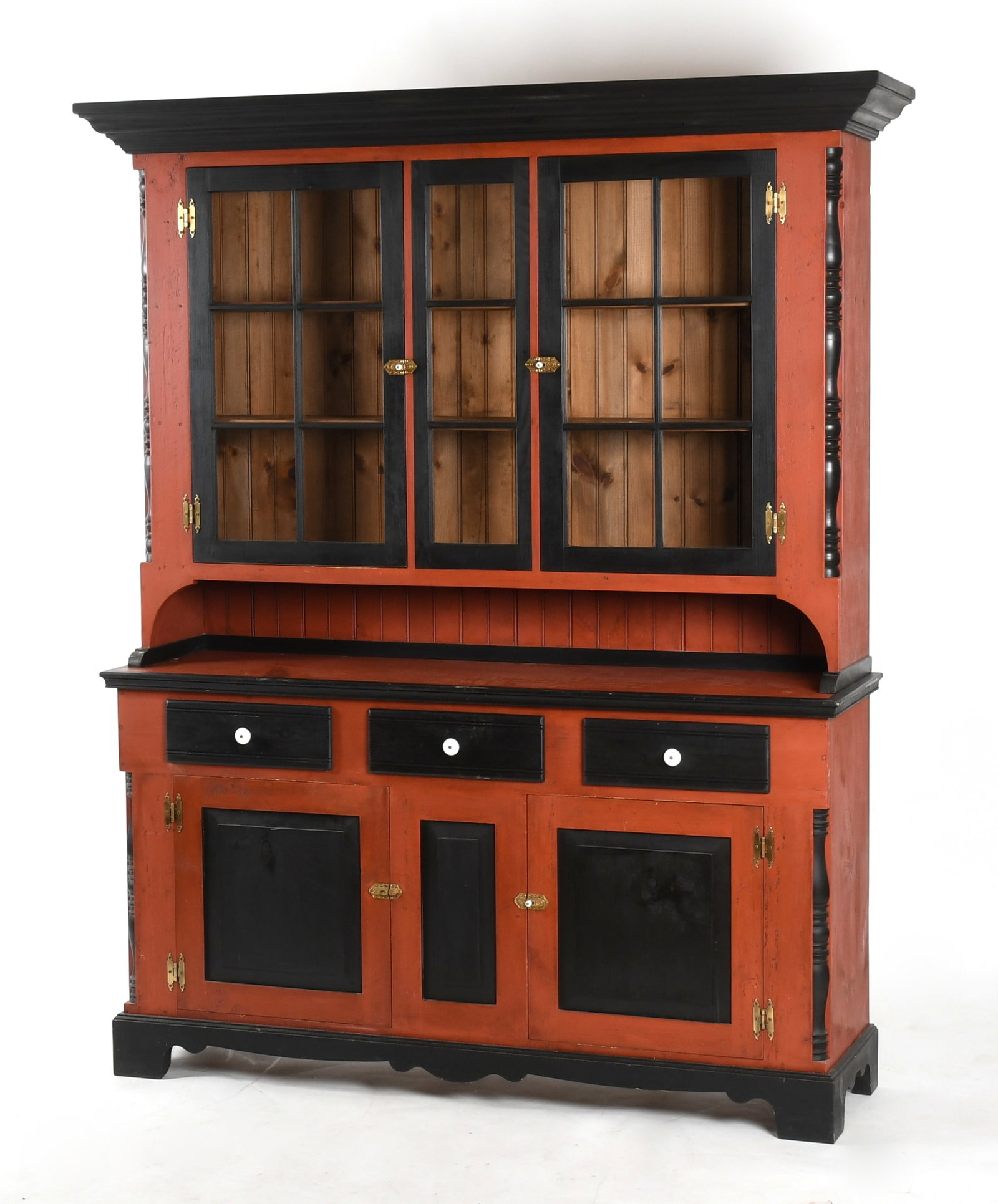 A Pennsylvania Red and Black-Painted Two-Part Dutch Cupboard, Late 20th Century: A Pennsylvania Red and Black-Painted Two-Part Dutch Cupboard, Late 20th Century Decorated in the Soap Hollow style. Dimensions: 65 1/4 in. wide, 17 3/4 in. deep, 85 in. high</