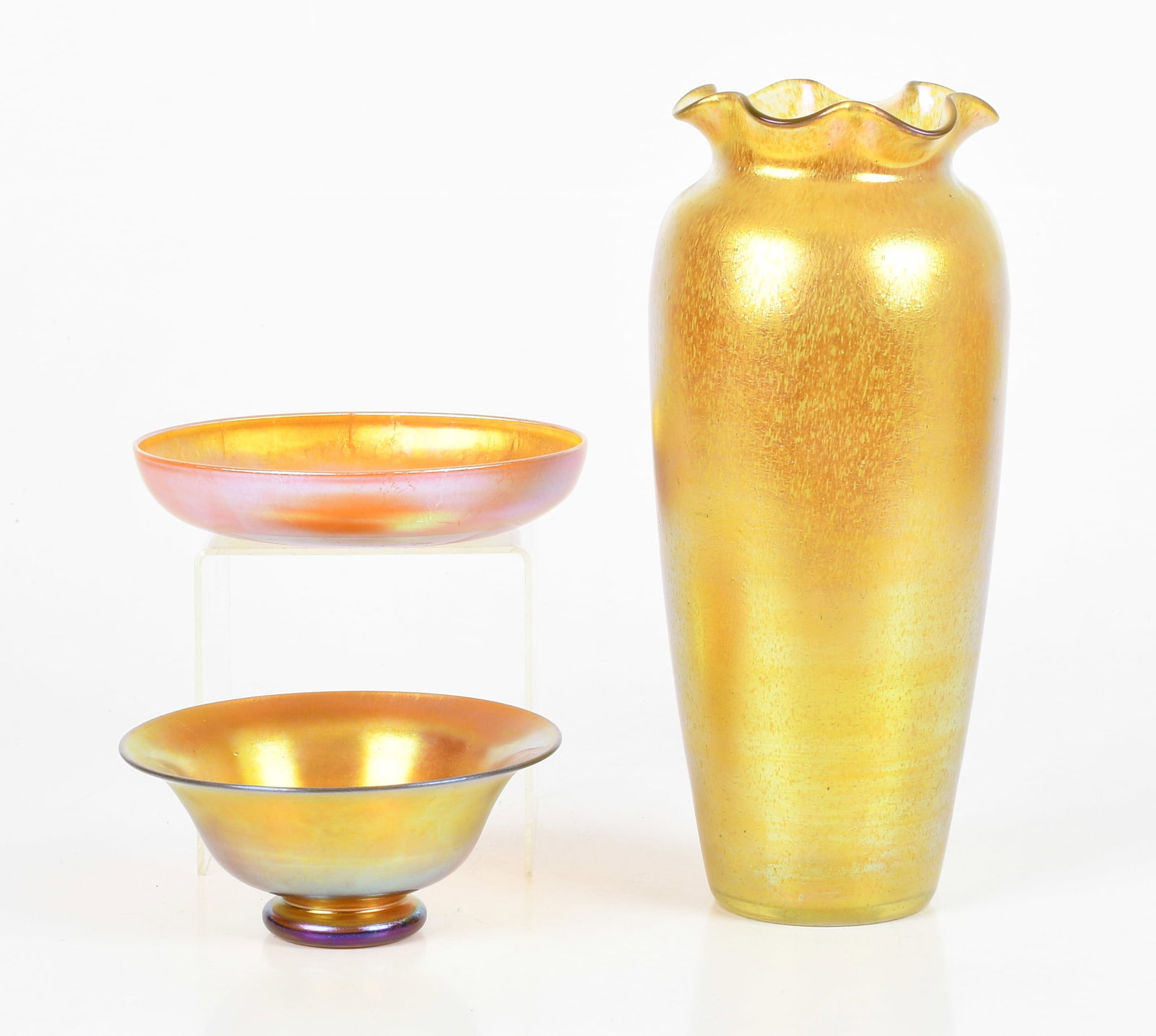 Three American Yellow Iridescent Glass Vessels, 20th Century: Three American Yellow Iridescent Glass Vessels, 20th Century Comprising: a vase with ruffled rim, apparently unmarked (11 1/2 in. high); a footed bowl, marked on the underside "aure