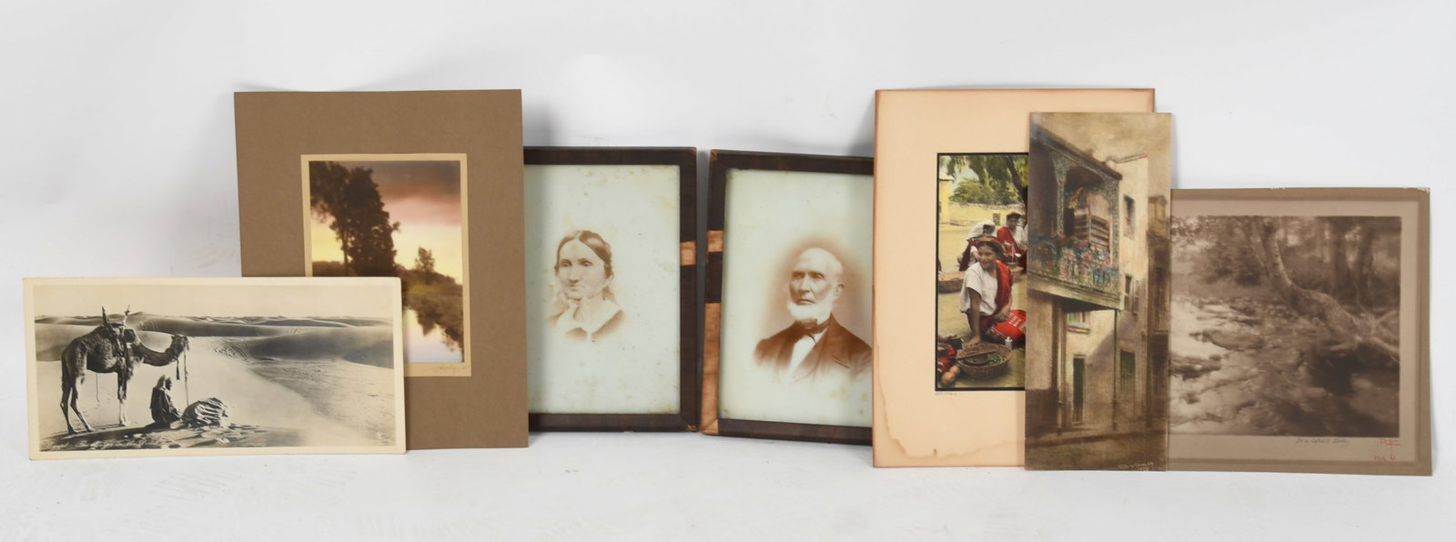 An Assorted Group of Photograph Prints: An Assorted Group of Photograph Prints 19th and 20th centuries, comprising: a pair of framed photograph prints on porcelain of couple, an albumen print "The Prayer in the Desert"