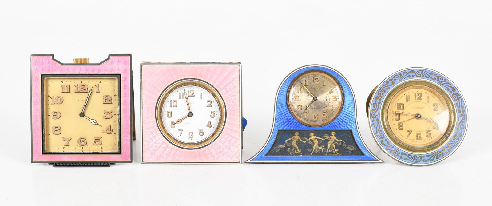 Four Enameled Desk Clocks: Four Enameled Desk Clocks Early 20th century, comprising: an eight day clock by Tiffany & Co. with pink enameled and niello sterling silver case, an Octava Watch Co., Switzerland 