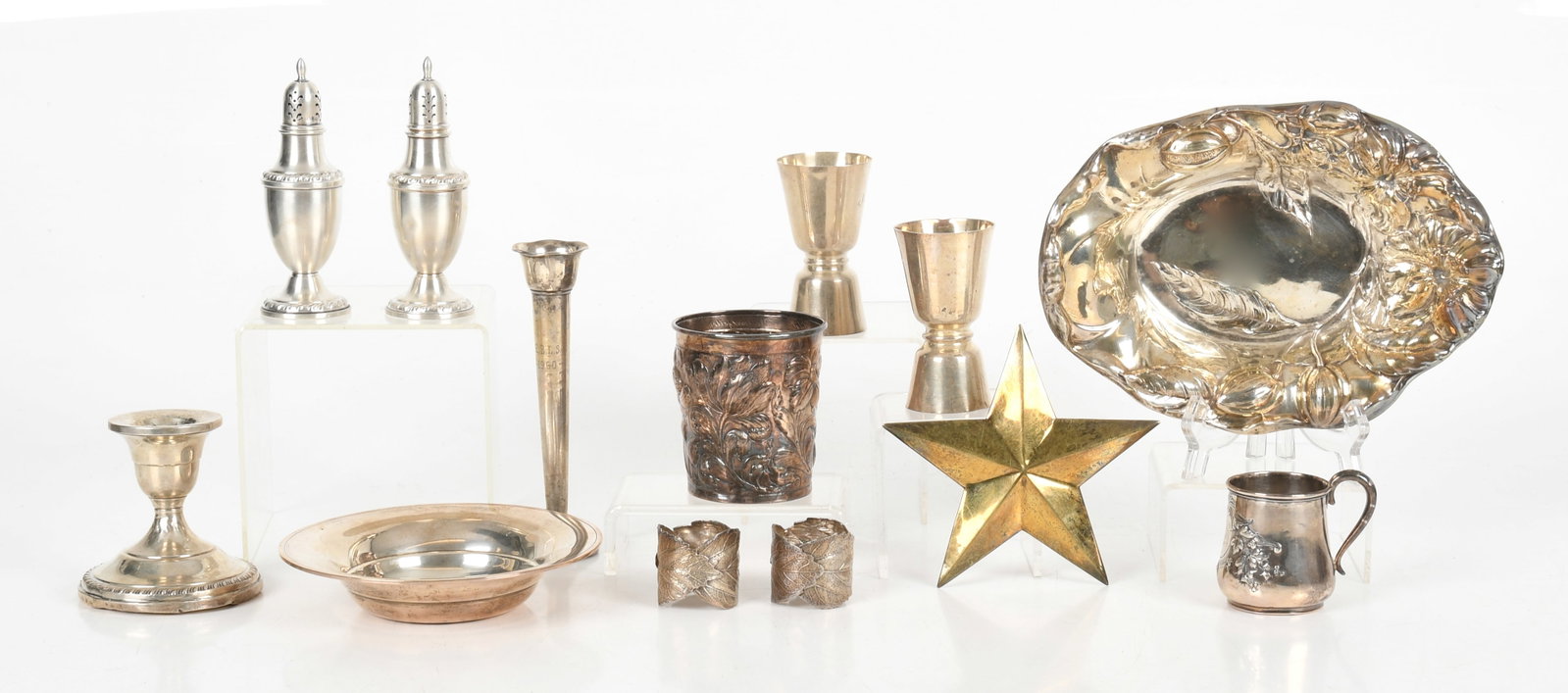 An Assorted Group of Silver Housewares: An Assorted Group of Silver Housewares Late 19th - 20th century, comprising: a 9in repousse centerpiece bowl by Webster Co., a 3 1/2in repousse silver cup by MMA fine silver, a 