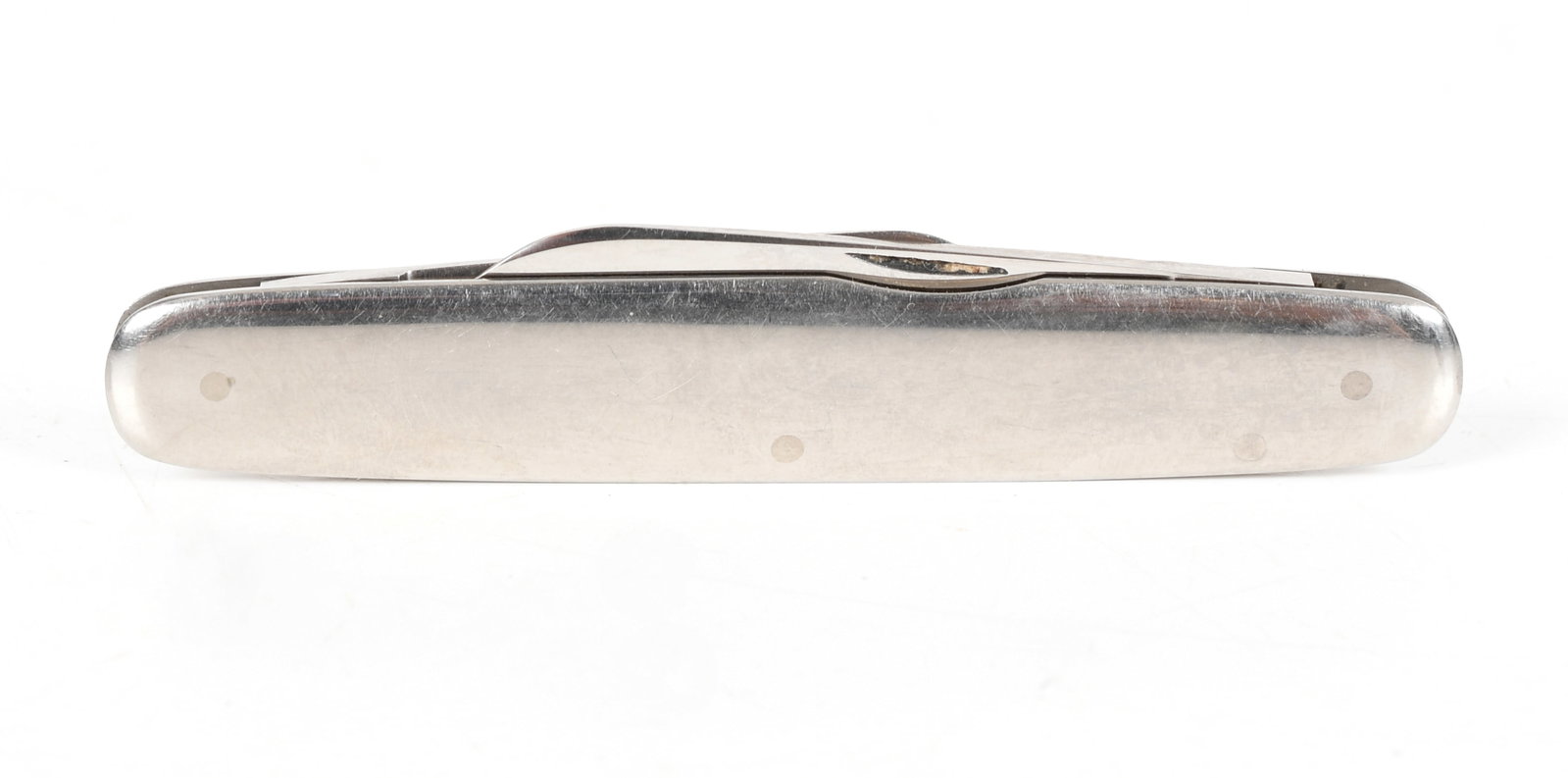 A White Gold Pocket Knife: A White Gold Pocket Knife 20th century, an undecorated example marked for Hayes Stellite. Dimensions: 3 1/2in long. The approximate gross weight is 23.4 dwt. Provenance: From a