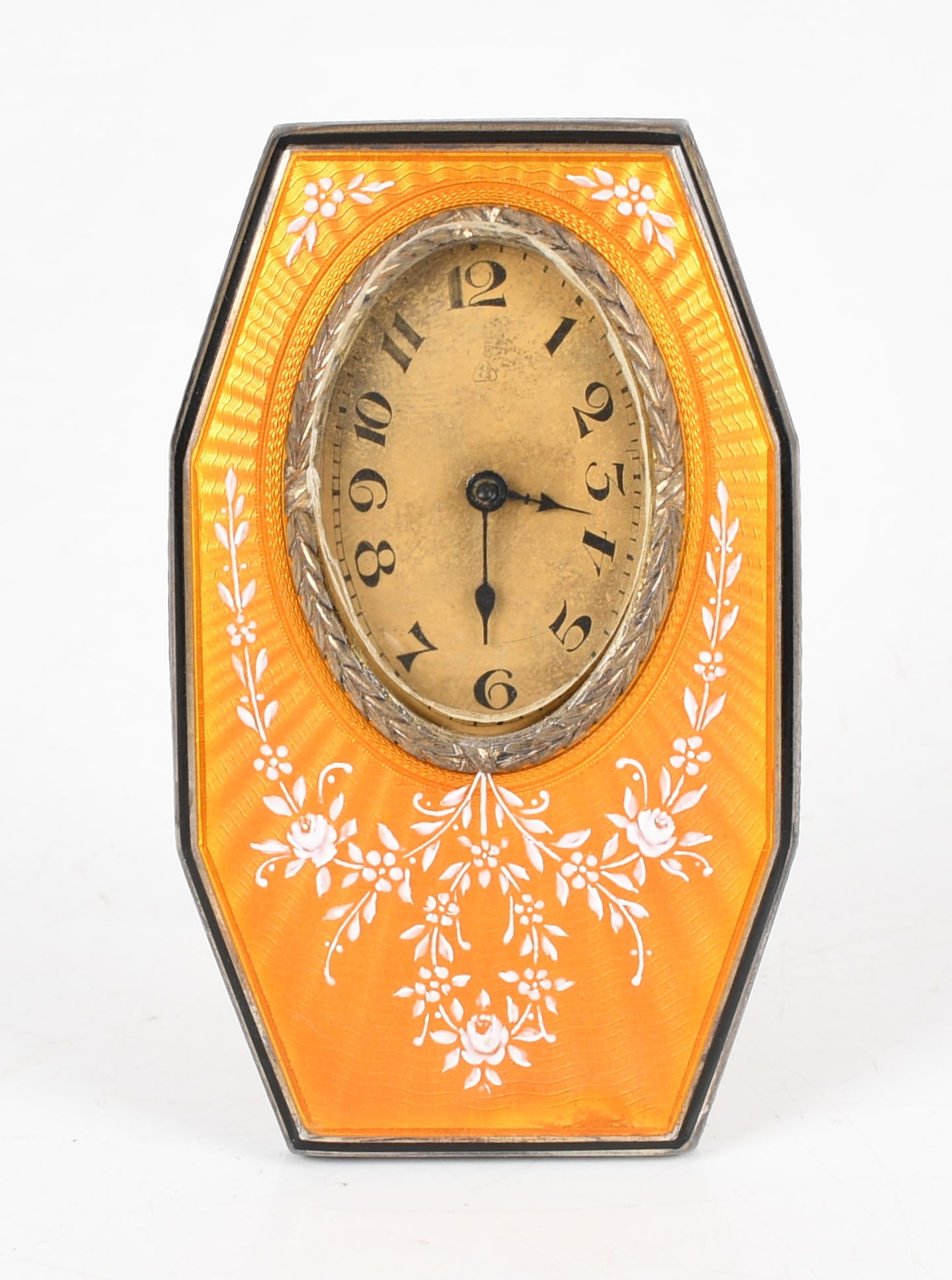 A Circa 1920 Desk or Travel Clock with Yellow Guilloche Case: A Circa 1920 Desk or Travel Clock with Yellow Guilloche Case Probably Swiss, with an octagonal dore metal case. With original presentation case. Dimensions: the clock is 3in x 2in,
