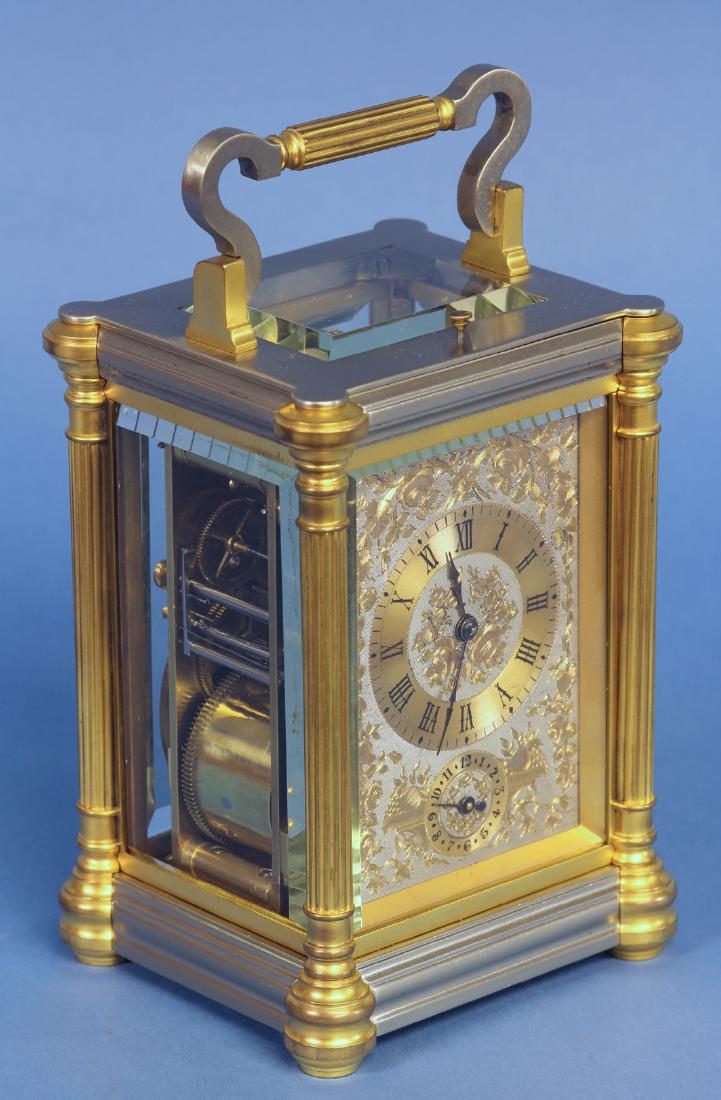 Late-19th century Grand-sonnerie Carriage Clock: Silver and gilt bronze case with columns to the corners. Two tone engraved dial with hours and alarm. Grand-sonnerie movement with original balance platform and adjustment lever out base. Recently res