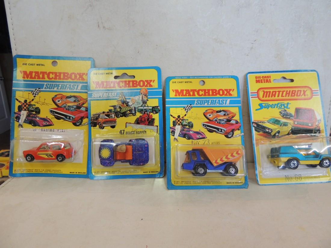 Matchbox: Lot of 4 Matchbox Superfast No. 47 beach hopper; No. 29 racing mini; No. 23 atlas; No.68 cosmobile; all sealed in bliste packs
