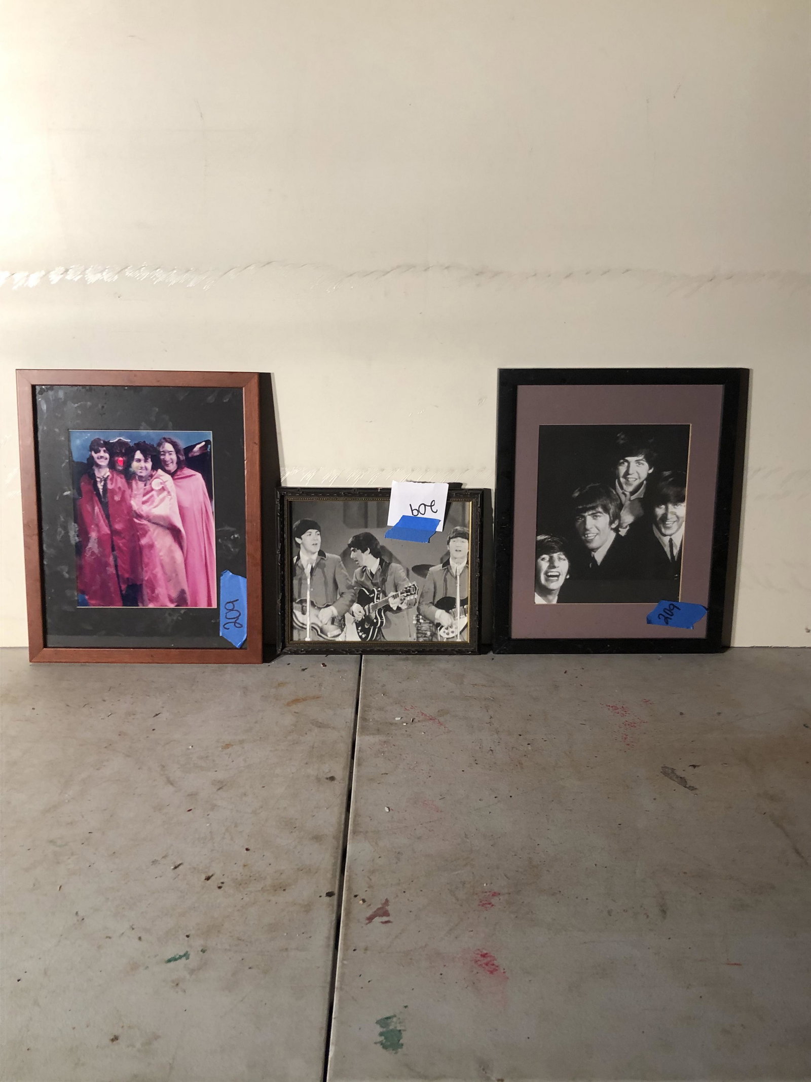 memorabilia: lot of 3 beatles pictures have been nailed to the wall
