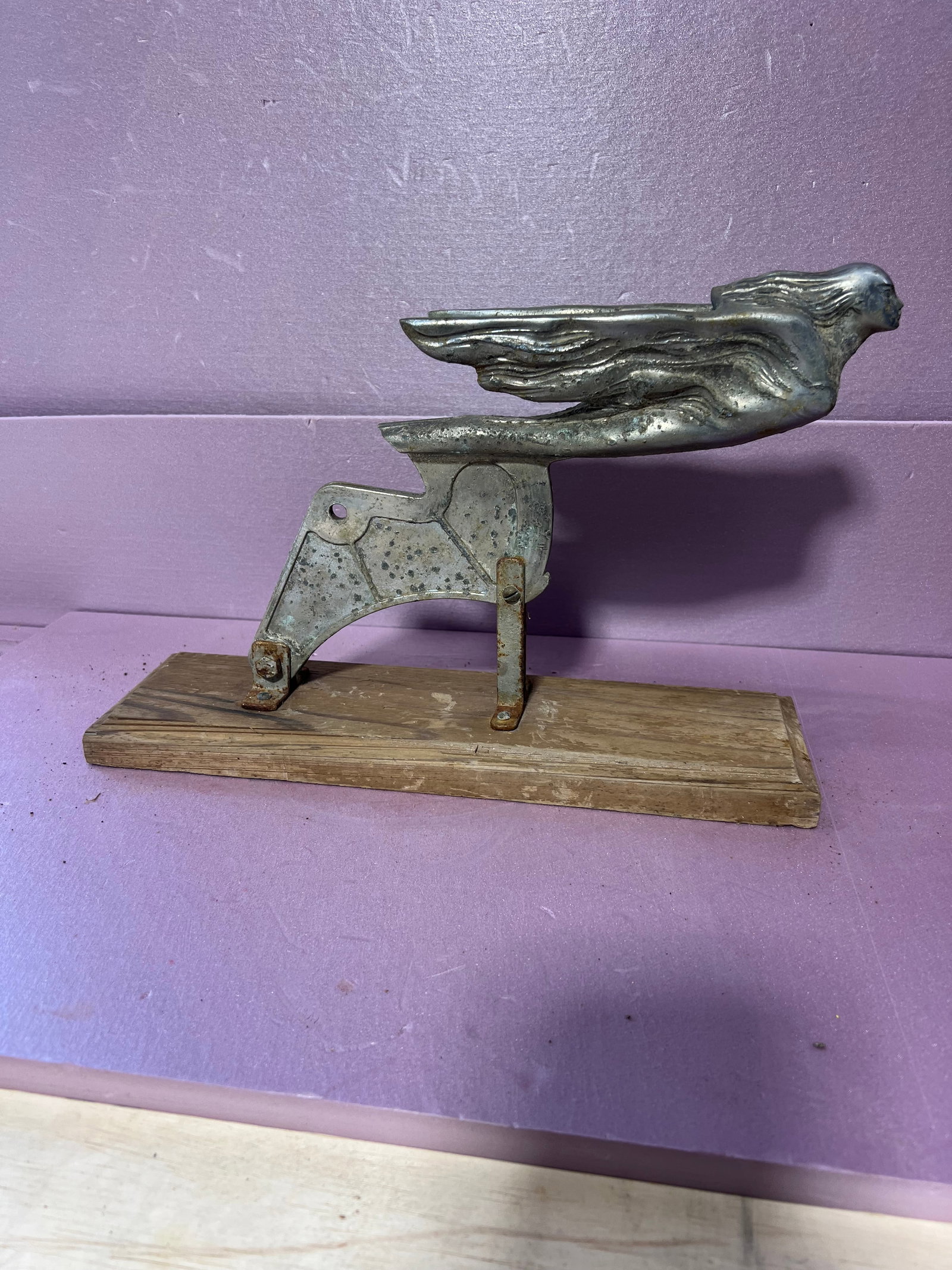 Cadillac Hood Ornament: vintage cadillac hood ornament from 1926 - 1950 known as the "Flying lady Goddess" it is mounted to a piece of wood for display purposes which can be removed. Shows wear, condition is good. This is so